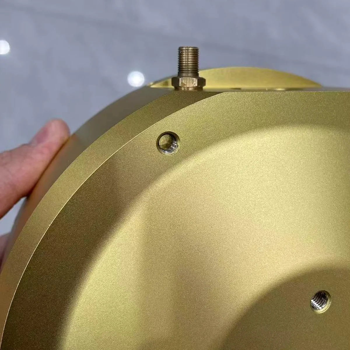 Aluminium camera casing after anodizing: exterior of the die-cast body with a machined threaded boss